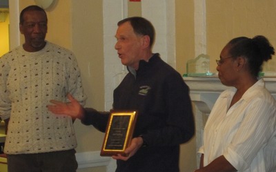 Bob Gaylord receiving the James Moore award from James (left) and Rebecca (right)
