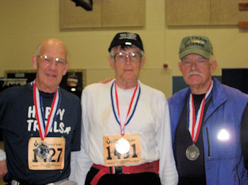 Paul, right, with Ed Demoney and Art Moore at the 2009 JFK finish